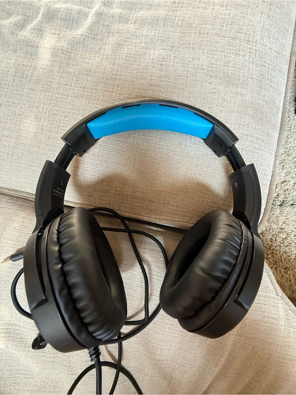 Black Over-Ear Gaming Headset with Blue Headband Accent